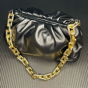 Black puffy shoulder bag with gold chain